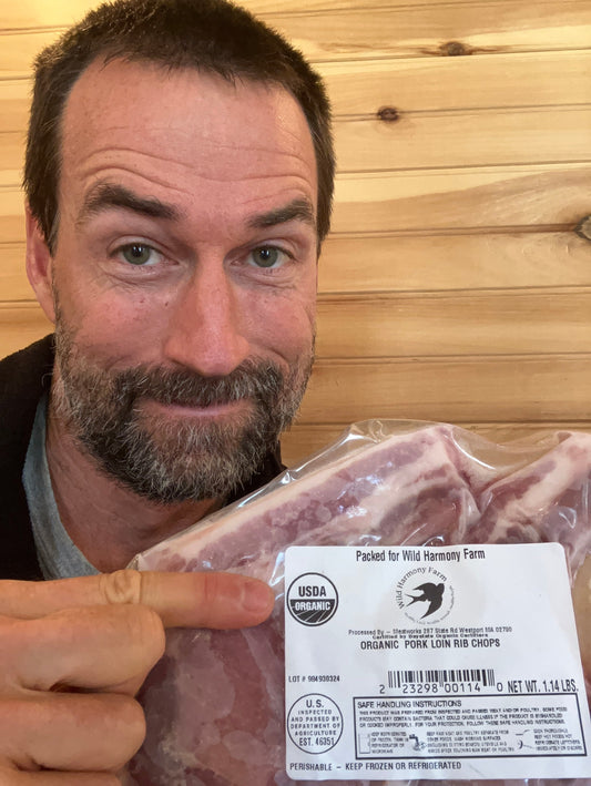 Ben pointing to organic seal on pork chops